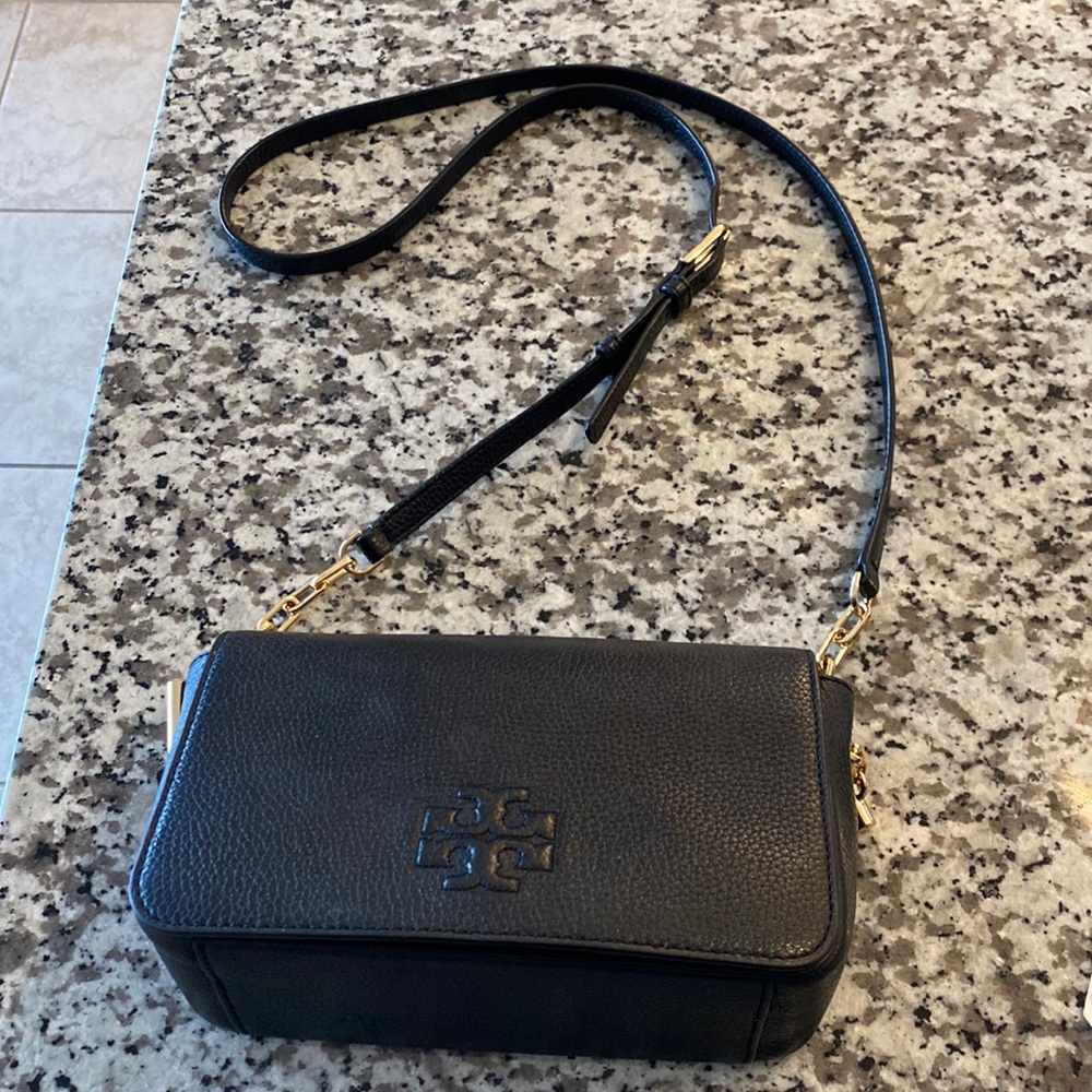 Black pebbled Tory Burch crossbody bag.